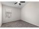 Bedroom featuring a ceiling fan and a large window with blinds at 11251 E Pratt Ave, Mesa, AZ 85212