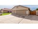 Three-car garage showcasing a spacious driveway at 11251 E Pratt Ave, Mesa, AZ 85212