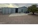 Back exterior view of home with shed, small patio and trees at 1143 S 96Th St, Mesa, AZ 85208