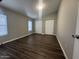 Bedroom features luxury vinyl plank flooring, good light, and closet with sliding doors at 1143 S 96Th St, Mesa, AZ 85208