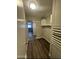 Hallway features luxury vinyl plank flooring and closet at 1143 S 96Th St, Mesa, AZ 85208