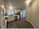 Well-lit kitchen with stainless steel appliances, white cabinets, and attractive tile backsplash at 1143 S 96Th St, Mesa, AZ 85208