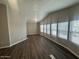 Spacious living room featuring luxury vinyl plank flooring and bright windows at 1143 S 96Th St, Mesa, AZ 85208