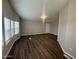 Spacious living room featuring luxury vinyl plank flooring and bright windows at 1143 S 96Th St, Mesa, AZ 85208