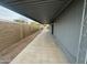 Spacious patio area running along the side of the house at 1143 S 96Th St, Mesa, AZ 85208