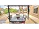 Outdoor dining area under gazebo with metal table and chairs at 15342 W Tasha Dr, Surprise, AZ 85374