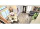 Bright dining room overlooking living area with views of the entry and stylish wood flooring at 15342 W Tasha Dr, Surprise, AZ 85374