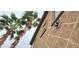 Exterior of the house with a palm tree and motion sensor security light at 15342 W Tasha Dr, Surprise, AZ 85374