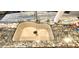 Kitchen sink features a beige basin, modern faucet, and beautiful stone countertops at 15342 W Tasha Dr, Surprise, AZ 85374