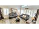 Living room with elegant furniture, plenty of light, and stylish decor throughout the home at 15342 W Tasha Dr, Surprise, AZ 85374
