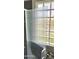 Modern shower with textured glass door, decorative tiled wall accents, and block glass window at 15342 W Tasha Dr, Surprise, AZ 85374