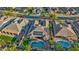 Stunning aerial view of the home with a sparkling pool, solar panels, and lush landscaping in a desirable neighborhood at 15430 W Sells Dr, Goodyear, AZ 85395