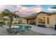 Inviting backyard featuring pool, desert landscaping, covered patio and an outdoor dining area at 15430 W Sells Dr, Goodyear, AZ 85395