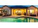 Stylish backyard patio area next to the pool, featuring outdoor furniture and perfect for relaxing or entertaining guests at 15430 W Sells Dr, Goodyear, AZ 85395