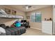 Bedroom with plush carpet, a bunk bed and a window at 15430 W Sells Dr, Goodyear, AZ 85395