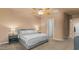 Inviting bedroom with neutral walls, bedside tables, and a cozy bed with fresh white bedding at 15430 W Sells Dr, Goodyear, AZ 85395