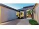 Gorgeous home entry with stone accents and desert landscaping, showcasing a warm and inviting entrance at 15430 W Sells Dr, Goodyear, AZ 85395