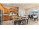Spacious kitchen with granite countertops, an island with seating, and stainless steel appliances at 15430 W Sells Dr, Goodyear, AZ 85395