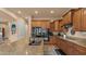 Beautiful kitchen featuring an island, stainless steel appliances, and wood cabinets at 15430 W Sells Dr, Goodyear, AZ 85395