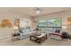 Bright living room featuring a large sectional sofa and natural light from big windows at 15430 W Sells Dr, Goodyear, AZ 85395