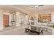 Open-concept living room flowing into the kitchen, creating an inviting and airy space at 15430 W Sells Dr, Goodyear, AZ 85395