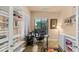 Functional home office featuring built-in shelves and a large window for natural light at 15430 W Sells Dr, Goodyear, AZ 85395
