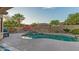 Beautiful pool with a rock waterfall feature, desert landscaping, and ample patio space at 15430 W Sells Dr, Goodyear, AZ 85395