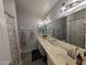 A full bathroom with dual sinks, shower, and ample storage space at 170 E Guadalupe Rd # 154, Gilbert, AZ 85234