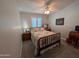 Cozy bedroom featuring a comfortable bed, nightstand, and window with blinds, creating a relaxing retreat at 170 E Guadalupe Rd # 154, Gilbert, AZ 85234