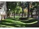 Shady community green space with mature trees and manicured lawns at 170 E Guadalupe Rd # 154, Gilbert, AZ 85234