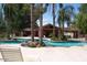 Community pool with covered seating and lush landscaping at 170 E Guadalupe Rd # 154, Gilbert, AZ 85234