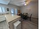 Cozy dining area with a round table and gray chairs next to the kitchen, offering a perfect spot for Gathering meals at 170 E Guadalupe Rd # 154, Gilbert, AZ 85234