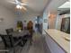 Open-concept dining area featuring a round table and gray chairs, seamlessly connected to the kitchen for easy entertaining at 170 E Guadalupe Rd # 154, Gilbert, AZ 85234