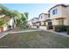 Charming townhomes featuring well-maintained lawns and mature trees at 170 E Guadalupe Rd # 154, Gilbert, AZ 85234