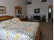 Bright main bedroom with a sitting area, fireplace, and ensuite bath featuring ample natural light at 170 E Guadalupe Rd # 154, Gilbert, AZ 85234