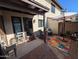 Cozy patio features seating, a colorful rug, and an umbrella for outdoor relaxation and entertaining at 170 E Guadalupe Rd # 154, Gilbert, AZ 85234