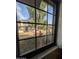 Picturesque view from a window showing a well-maintained lawn and neighboring townhomes at 170 E Guadalupe Rd # 154, Gilbert, AZ 85234