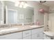 Bright bathroom with double vanity, granite countertops, and ample storage at 19084 N Toledo Ave, Maricopa, AZ 85138