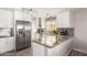 Modern kitchen featuring stainless steel appliances, granite countertops, and ample cabinet space at 19084 N Toledo Ave, Maricopa, AZ 85138