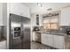 Well-lit kitchen featuring stainless steel appliances, granite countertops, and ample storage at 19084 N Toledo Ave, Maricopa, AZ 85138