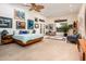 Spacious bedroom featuring a ceiling fan, natural light, and stylish furnishings at 19644 N Majestic Vista Ct, Surprise, AZ 85387