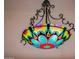 A flower-shaped chandelier boasts vibrant colors, adding a whimsical touch to the home's interior design at 19644 N Majestic Vista Ct, Surprise, AZ 85387