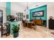 Dining room with colorful walls, tile floors, and plantation shutters at 19644 N Majestic Vista Ct, Surprise, AZ 85387