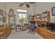 Cozy home office with built-in cabinets, bookshelves, a large window with mountain views, and carpet at 19644 N Majestic Vista Ct, Surprise, AZ 85387