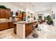 Spacious kitchen with wood cabinets, stone countertops, and stainless steel appliances at 19644 N Majestic Vista Ct, Surprise, AZ 85387