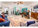 Bright living room with marble floors, turquoise accent wall, and stylish furnishings at 19644 N Majestic Vista Ct, Surprise, AZ 85387