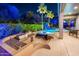 Outdoor kitchen with built-in grill, ample counter space, and bar seating, perfect for entertaining by the pool at 19644 N Majestic Vista Ct, Surprise, AZ 85387