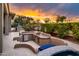 Outdoor kitchen featuring a built-in grill and bar with tiled accents near a pool and patio area at 19644 N Majestic Vista Ct, Surprise, AZ 85387
