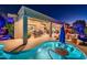 A covered patio overlooks a sparkling pool, outdoor kitchen and bar area, creating an ideal outdoor entertaining space at 19644 N Majestic Vista Ct, Surprise, AZ 85387