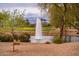 Picturesque water fountain in a pond, surrounded by lush greenery and landscaping at 19644 N Majestic Vista Ct, Surprise, AZ 85387